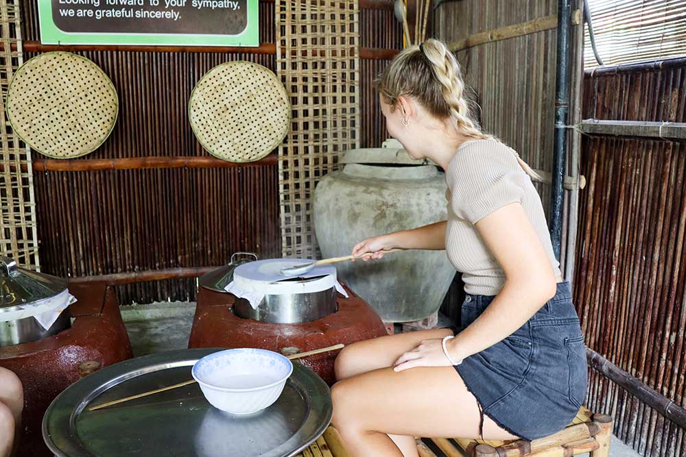 Making Rice Paper During Cooking Class Hoi An Bamboo Village in Vietnam