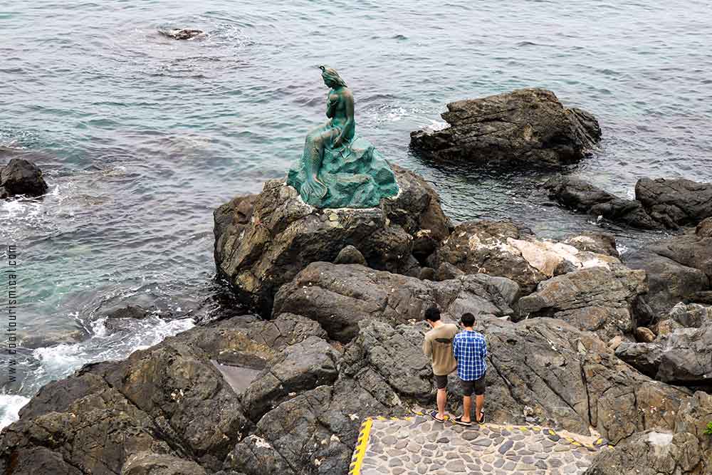 Dongbaekseom Island Mermaid Statue in Busan's Haeundae Beach